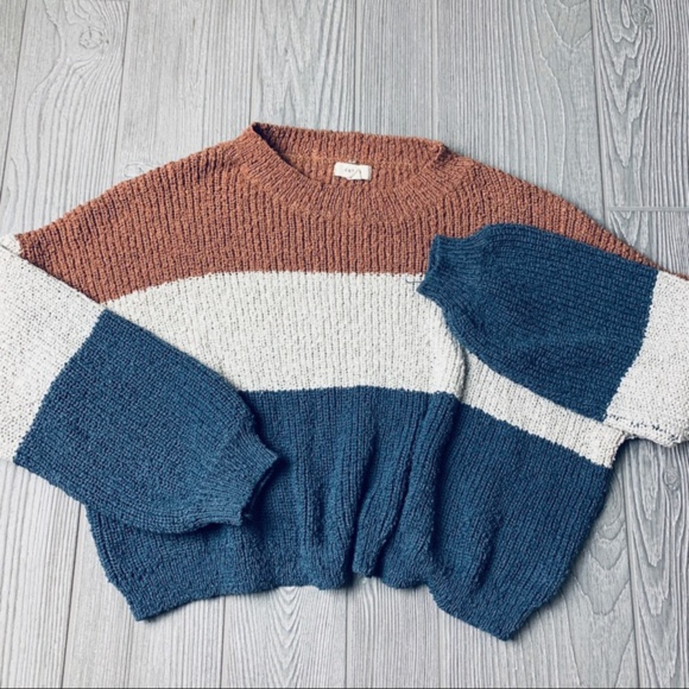 Large orange, white, and blue sweater